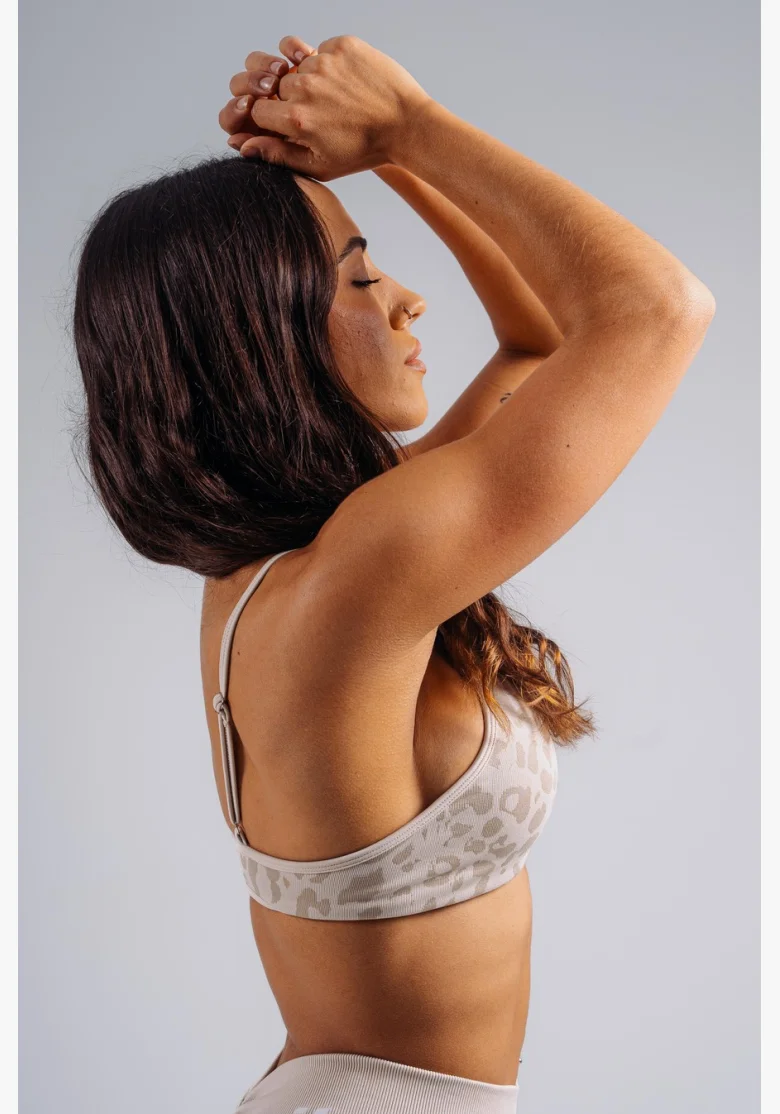 NEBBIA reggiseno sportivo a sostegno medio con motivo leopardato PRIMAL crema