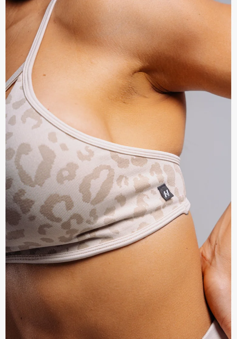 NEBBIA reggiseno sportivo a sostegno medio con motivo leopardato PRIMAL crema