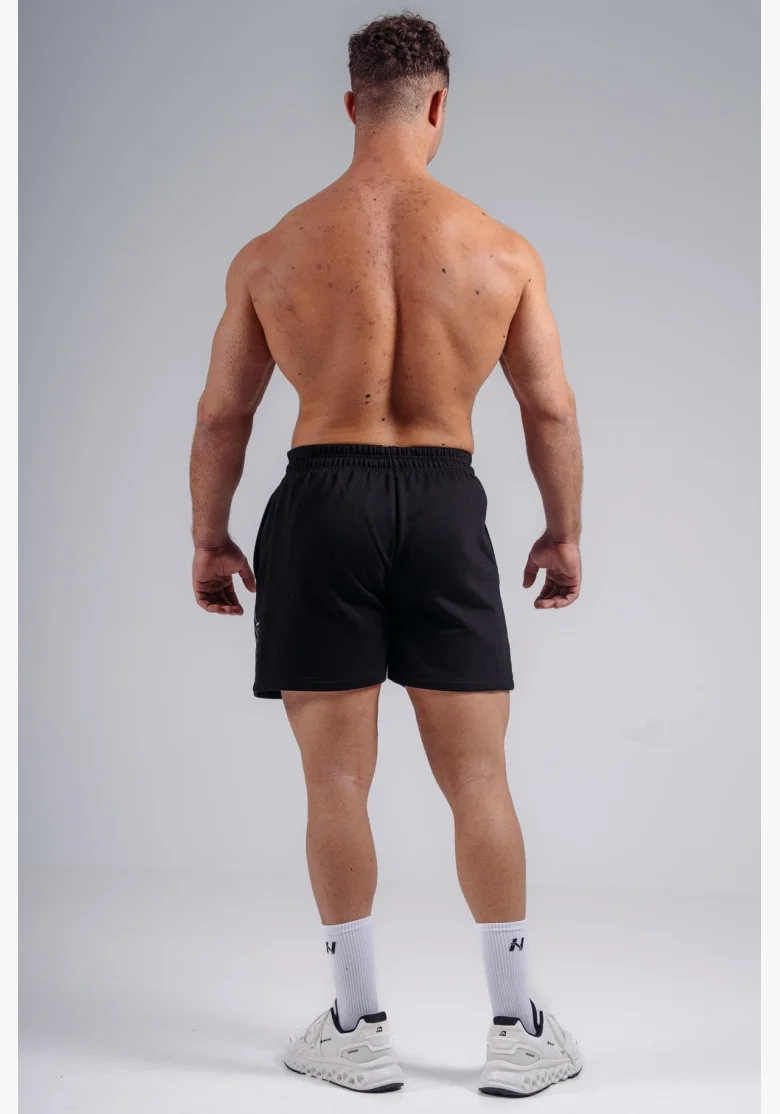 NEBBIA pantaloncini da allenamento oversize PRIMAL neri