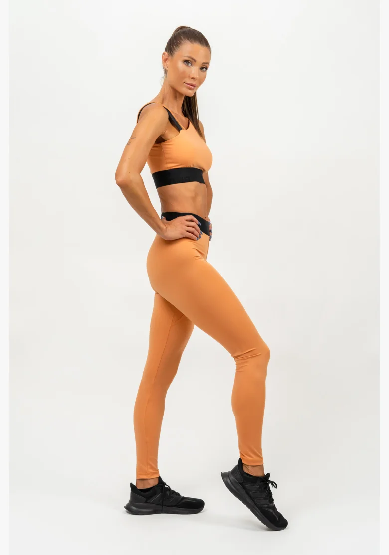 NEBBIA • Reggiseno sportivo asimmetrico ELITE arancione • Nebshop.cz