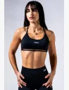 Il reggiseno sportivo con tecnologia seamless, design open-back e supporto medio è la scelta ideale per gli allenamenti intensivi e un look da palestra distintivo.